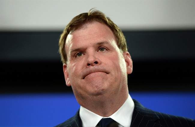 Minister of Foreign affairs John Baird holds a press conference at the National Press Theatre in Ottawa on Dec. 19, 2014. 
