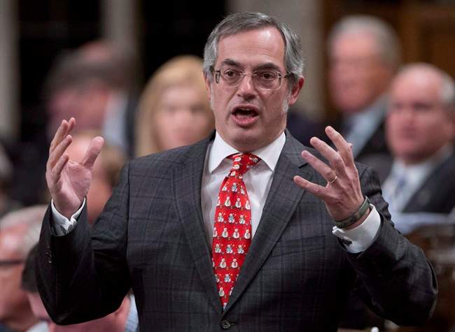Treasury Board President Tony Clement responds to a question during question period in the House of Commons in Ottawa on December 4, 2014. 