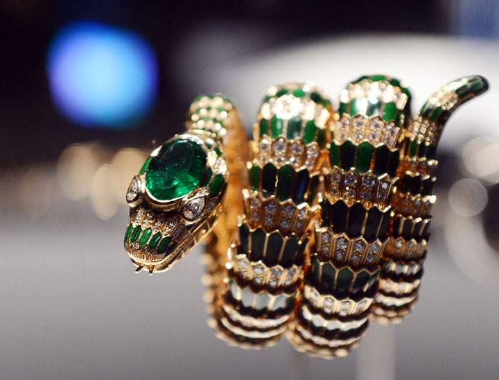 The 1968 'Snake' bracelet-watch in gold with diamonds and green enamel and emeralds is on display during the exhibition, 'BVLGARI, Italian Magnificence.'