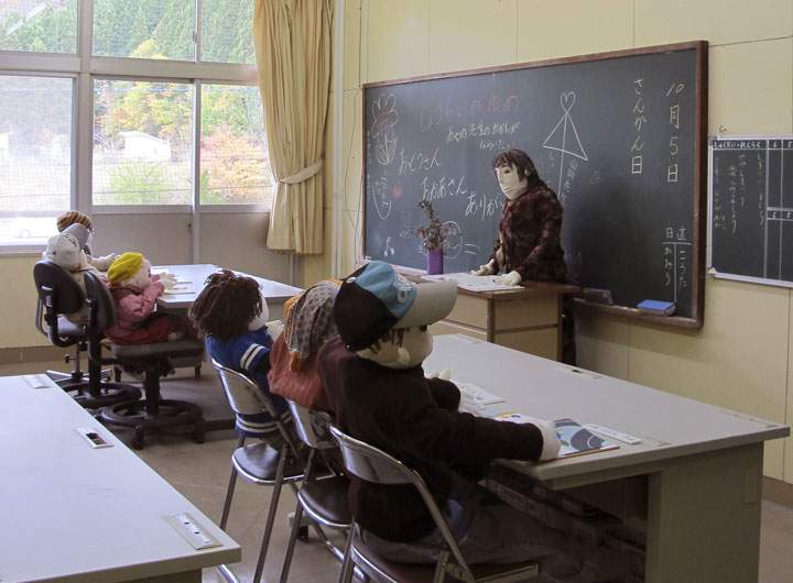 In this Thursday, Nov. 6, 2014 photo, scarecrow teacher and students fill a classroom in the now deserted elementary school in Nagoro, Tokushima Prefecture, southern Japan.