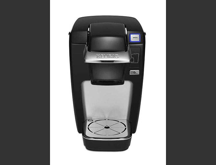 This undated product image from Keurig and released by the Consumer Product Safety Commission shows the Keurig Mini Plus coffee brewer. Keurig is recalling more than 7 million of the single-serve coffee brewing machines after reports that a number of them had spewed hot liquids and injured dozens of users, the company said Tuesday, Dec. 23, 2014.