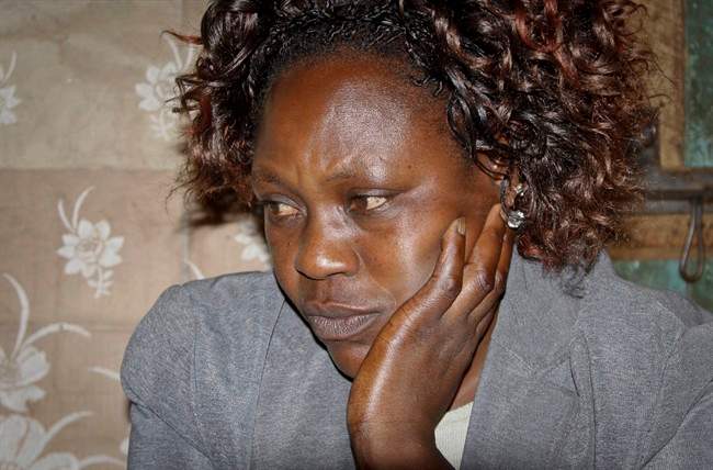 In this May 9, 2014 photo, Marion Wanjiru Mohamed, speaks to The Associated Press in Nyeri, Kenya. The body of Mohamed's son Yusuf Mohamed and four of his friends were discovered April 17 with bullet holes in their heads deep in a forest near the central Kenyan town of Nyeri. The last time the five were seen was in police custody according to their families.