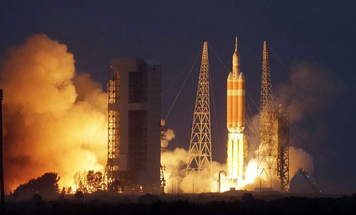NASA’s Orion spacecraft lifts off on its first unmanned orbital test flight from the Cape Canaveral Air Force Station Friday, Dec. 5, 2014, in Cape Canaveral, Fla.