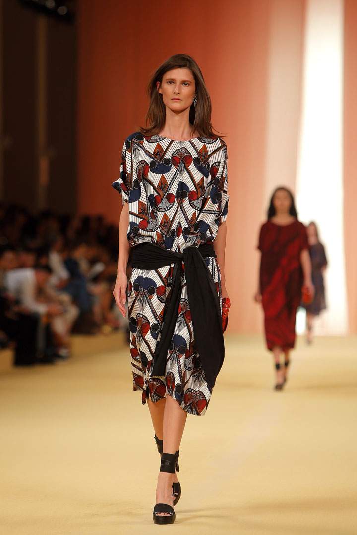 In this Oct. 1, 2014 file photo, a model wears a creation as part of Hermes' Spring/Summer 2015 ready-to-wear fashion collection for Hermes, presented in Paris, France. Marsala, the wine-influenced, red-kissed color of 2015, was chosen by Pantone. Pantone's yearly picks can herald a marked presence of a color in fashion, beauty, housewares, home design and consumer packaging, though some years the influence is stronger than others.
