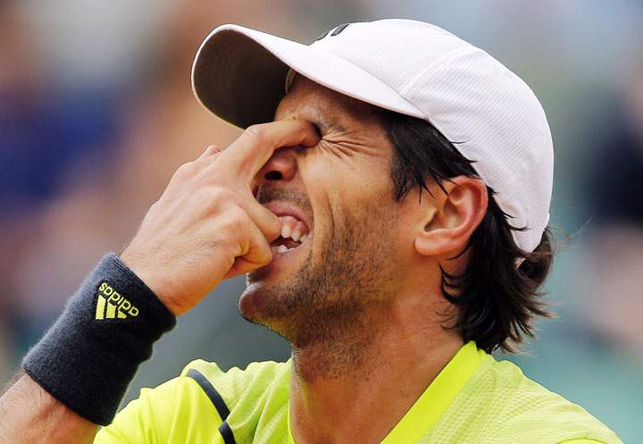 Spain’s Fernando Verdasco puts his fingers in his eyes during a match at the French Open on Monday, June 2, 2014.