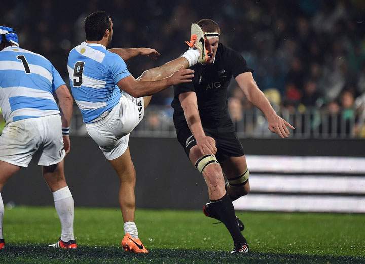Argentina’s Martin Landajo kicks at New Zealand’s All Blacks Brodie Retallick during their rugby match at McLean Park in Napier on September 6, 2014.