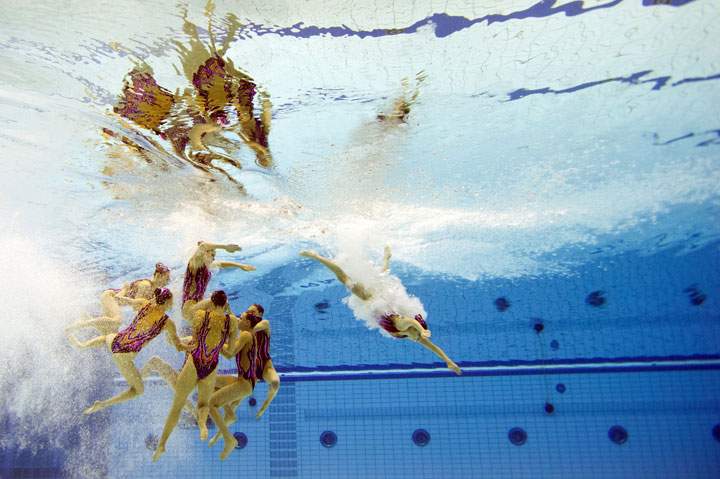 This picture taken with an underwater camera shows Belarus’ team competing in the synchronized swimming Team free routine final event at the LEN European swimming championships on August 16, 2014 in Berlin.