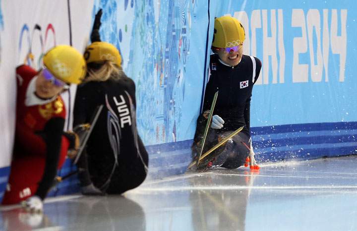 South Korea’s Kim Alang (R) falls as she competes in the Women’s Short Track 1500 m Final at the Iceberg Skating Palace during the Sochi Winter Olympics on February 15, 2014.