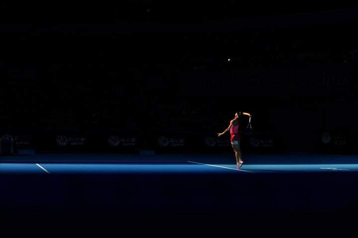 Simona Halep serves against Andrea Petkovic during their women’s singles third round match at the China Open in the National Tennis Center of Beijing on October 2, 2014.