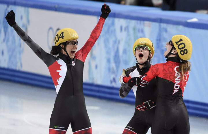 Canada’s Marie-Eve Drolet, Valerie Maltais and Marianne St-Gelais, (left to right) react as the results are announced winning the silver medal in the women’s 3,000 metre relay final at the Sochi Winter Olympics Tuesday, February 18, 2014 in Sochi.