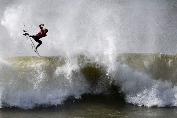 Hawaian surfer John John Florence competes during his quarter-final heat of the Moche Rip Curl Pro Portugal at Supertubos Beach in Peniche on October 20, 2014.