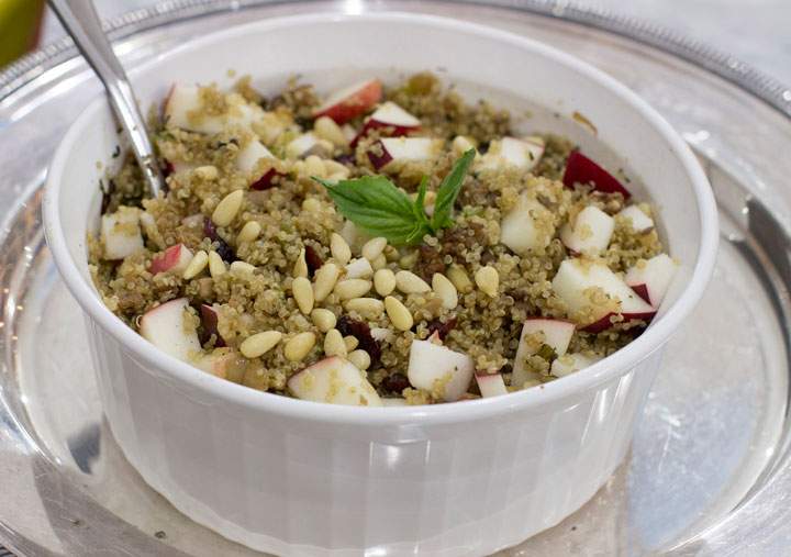 This Dec. 1, 2014, photo shows winter quinoa dressing with apples and dried cranberries in Concord, N.H.