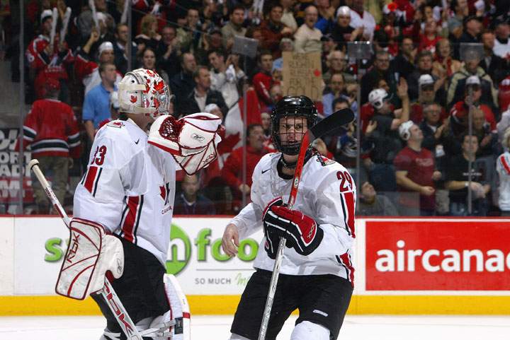 Justin Pogge #33 and Jonathan Toews #29 of Team Canada in action against Team Russia during the gold medal game at the World Junior Hockey Championships at General Motors Place on January 5, 2006 in Vancouver, British Columbia, Canada. Team Canada defeated Team Russia 5-0 to win the gold medal.