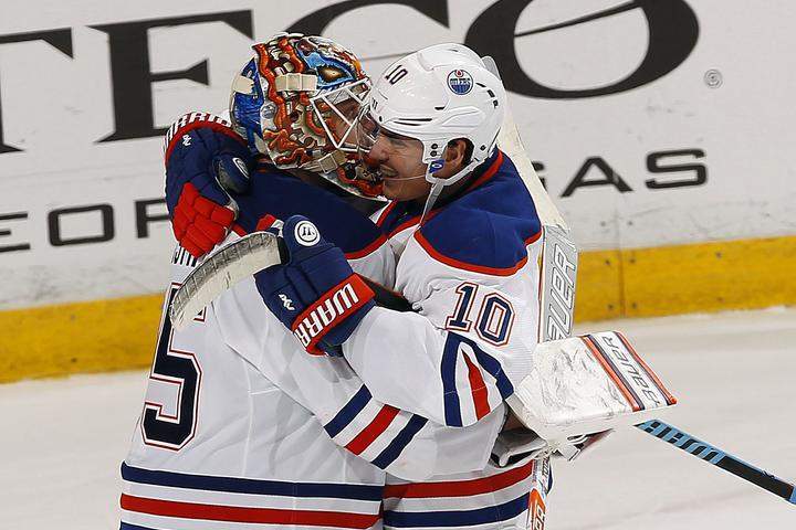 Goaltender Viktor Fasth #35 of the Edmonton Oilers celebrates their shootout win with teammate Nail Yakupov #10 who scored the game winning goal against the Florida Panthers at the BB&T Center on December 17, 2015 in Sunrise, Florida.