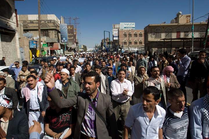 Protesters chant slogans against Houthi Shiite rebels who hold the capital, Sanna, amid a power vacuum as they march on a street in Sanaa on Saturday, Jan. 24, 2015. 