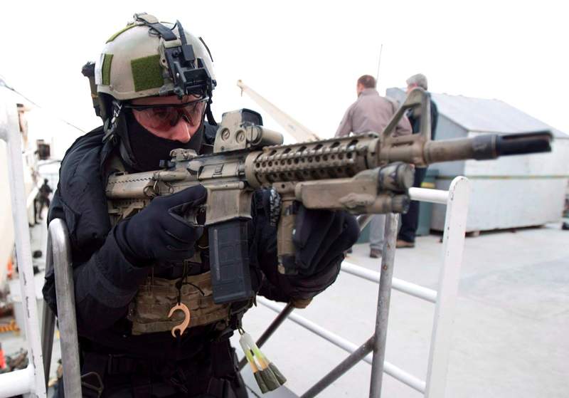 Members of Canadian Forces Special Operations JTF2 unit storm a ship during Operation Nanook off the shores of Churchill, Man. Friday August 24, 2012. 
