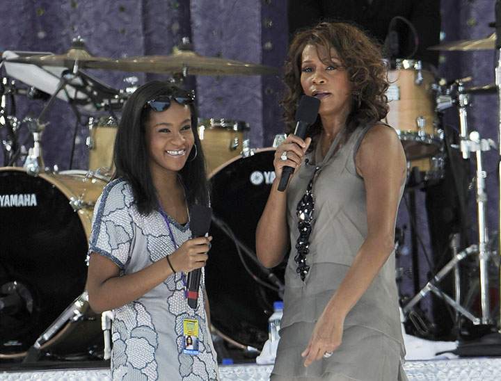 Bobbi Kristina on stage with her mom Whitney Houston.