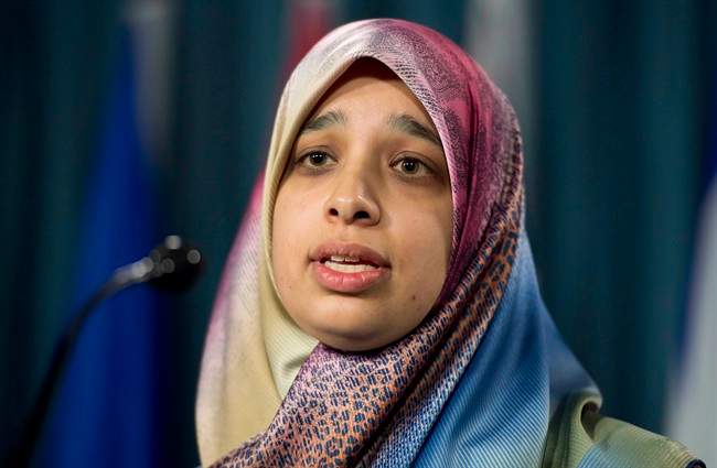Sarah Attia, wife of Khaled Al-Qazzaz, detained without charges in Egypt, attends a news conference, Tuesday April 29, 2014 in Ottawa. THE CANADIAN PRESS/Adrian Wyld.