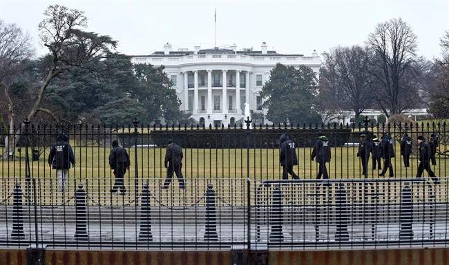 Secret Service officers search the south grounds of the White House in Washington, Monday, Jan. 26, 2015.