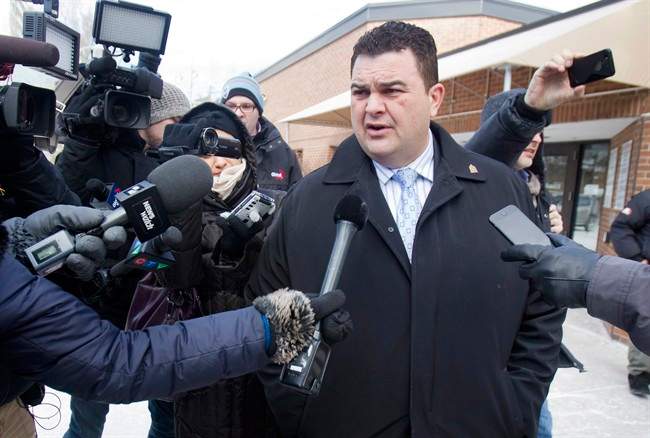 Former Conservative MP Dean Del Mastro talks to media as he leaves court for lunch break at a sentencing hearing in Peterborough Ont., Tuesday, January 27, 2015.