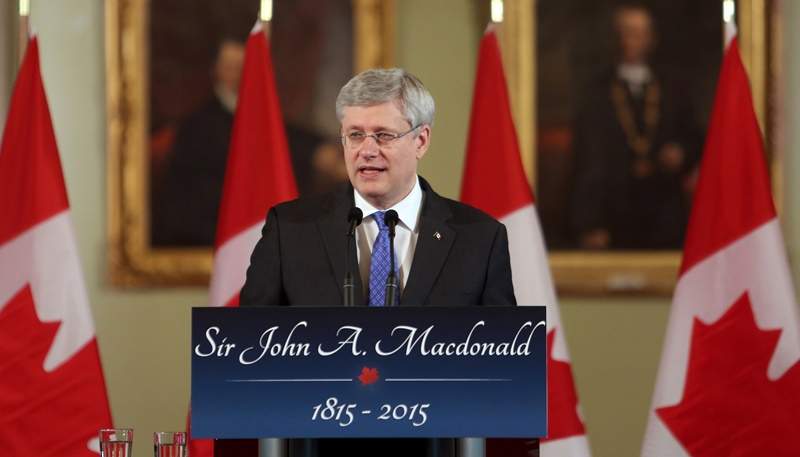 Prime Minister Stephen Harper delivers remarks as he takes part in a ceremony at Kingston city hall, to mark the bicentennial of Canada's first prime minister, Sir John A Macdonald's birth date, in Kingston, Ontario, Sunday, January 11, 2015. 