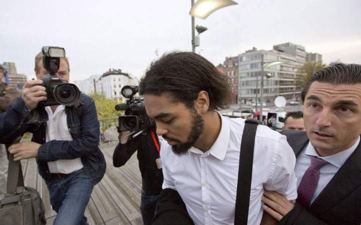 Jejoen Bontinck, center left, arrives with his lawyer Kris Luyckx to the main courthouse in Antwerp, Belgium on Monday, Sept. 29. Bontinck's father said he went to Syria to rescue him and has since returned to attempt to rescue other radicalized youth.