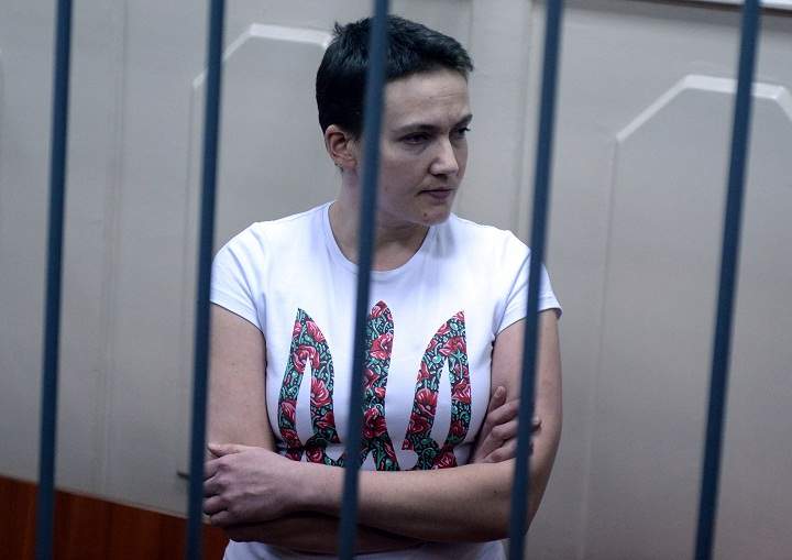 Detained Ukrainian helicopter pilot Nadiya Savchenko stands inside the defendant’s cage during her hearing in the Basmanny district court in Moscow on November 11, 2014.