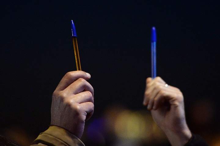 People hold pens in Marseille, southern France, on January 7, 2015, as they take part in a gathering following an attack by unknown gunmen on the offices in Paris of satirical weekly Charlie Hebdo.