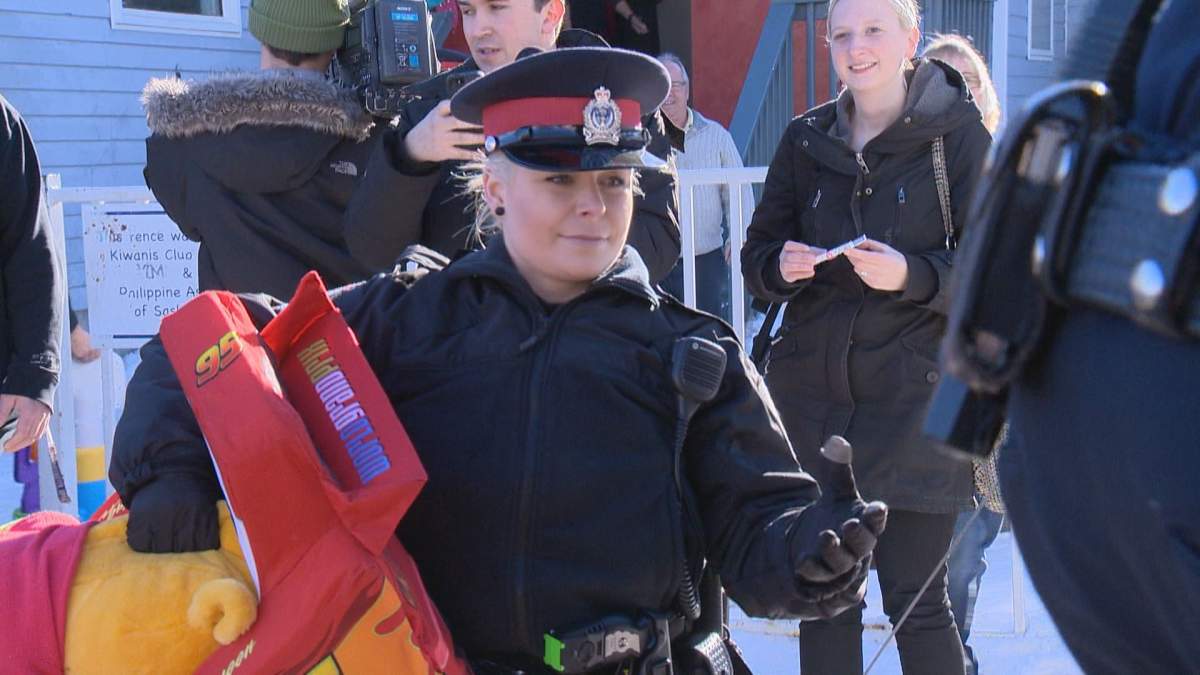 Const. Desiree Mills, along with her fellow officers, delivered about 1,000 donated toys to the North Central Family Centre on Friday.
