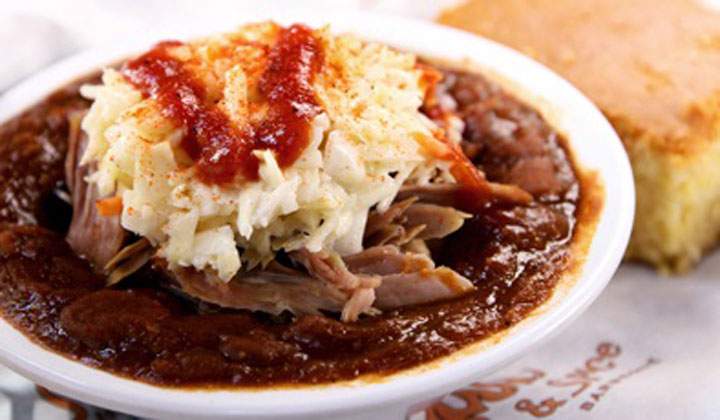 BBQ baked beans topped with pulled pork and homemade slaw dressing.