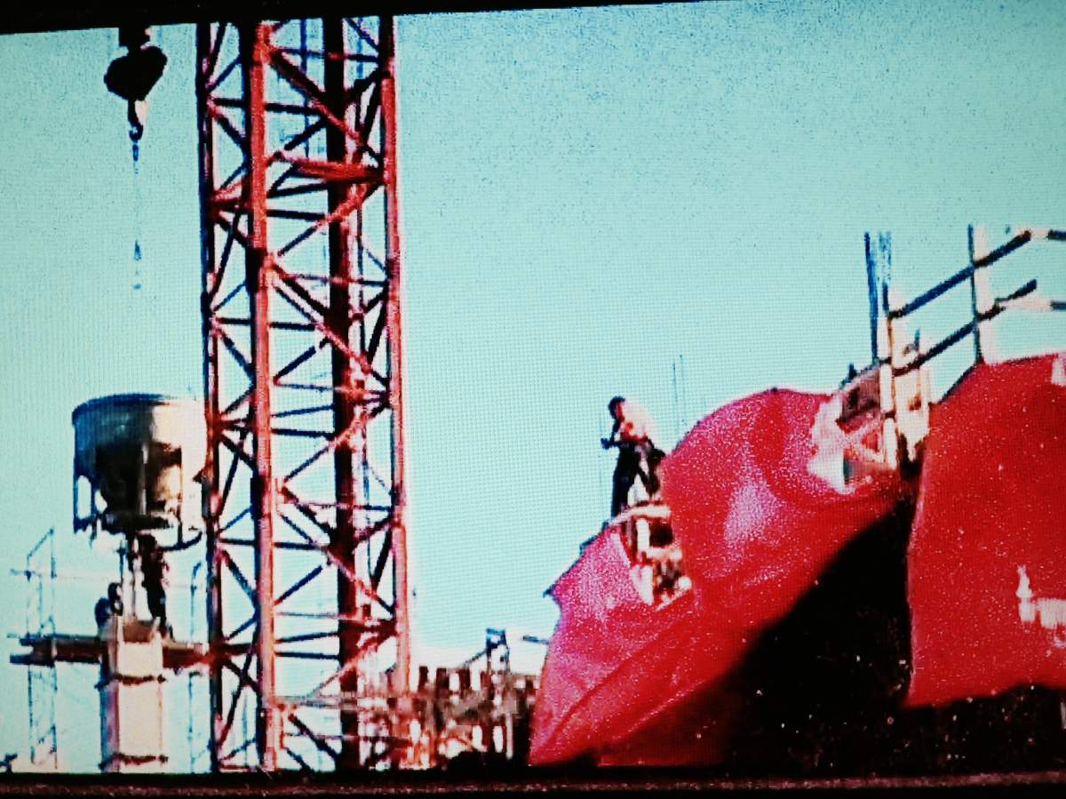 A photo taken by John Ball on December 29, 2014 of a worker on a roof allegedly without a safety harness.