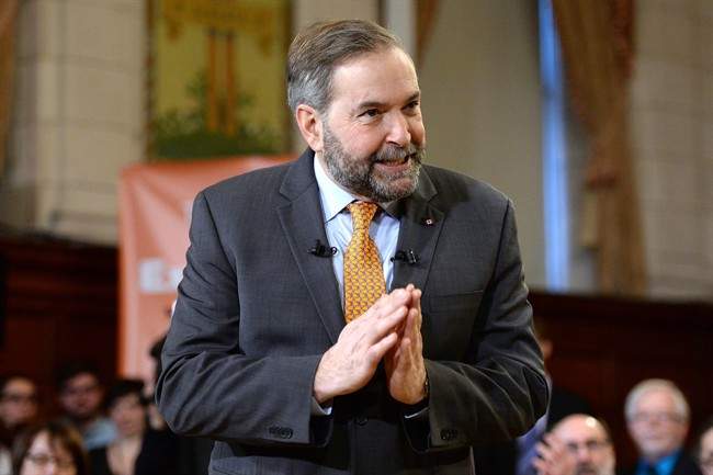 NDP Leader Thomas Mulcair speaks ahead of a caucus meeting in Ottawa on Thursday, Jan. 15, 2015. 