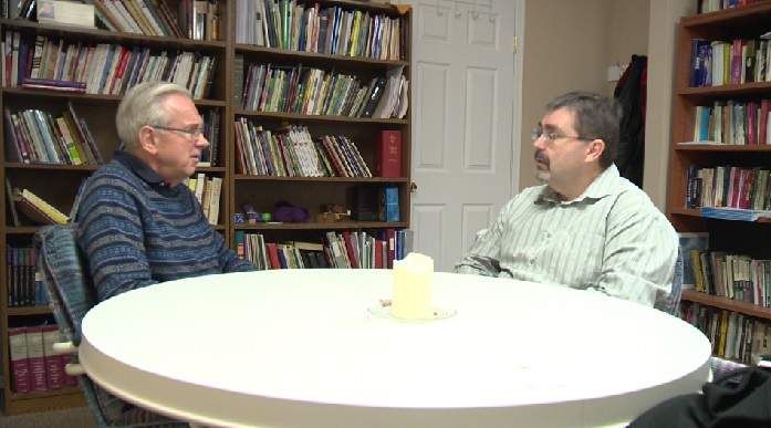David Sparks (left) and Armound Houle (right) discussing how to help a refugee family coming to Summerland.