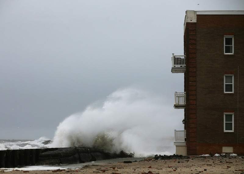 Heavy surf pounds the shoreline where a boardwalk once stood before it was damaged by Hurricane Sandy, on January 26, 2015 in Atlantic City, NJ. Much of the Northeast is bracing for a major winter storm which is expected to bring blizzard conditions and 10 to 30 inches of snow in some areas.
