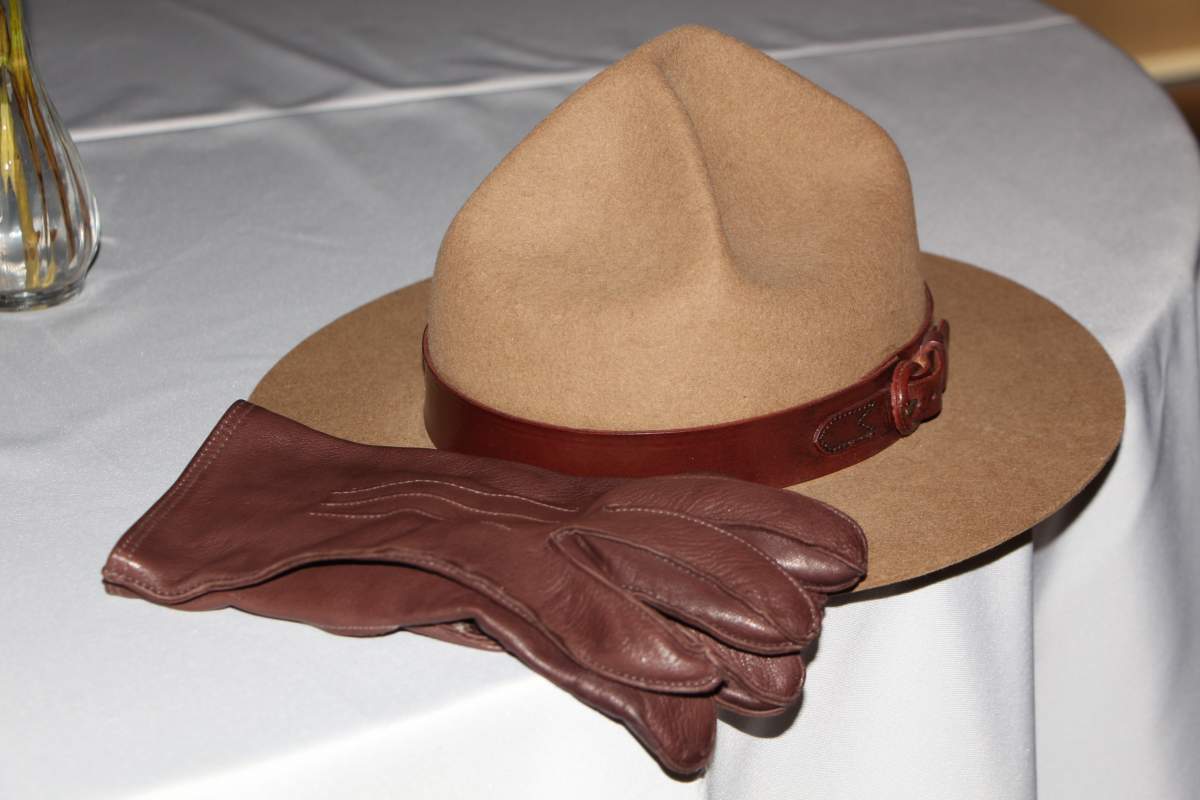 RCMP gloves and a stetson sit on a table for a memorial to RCMP Const. David Wynn.