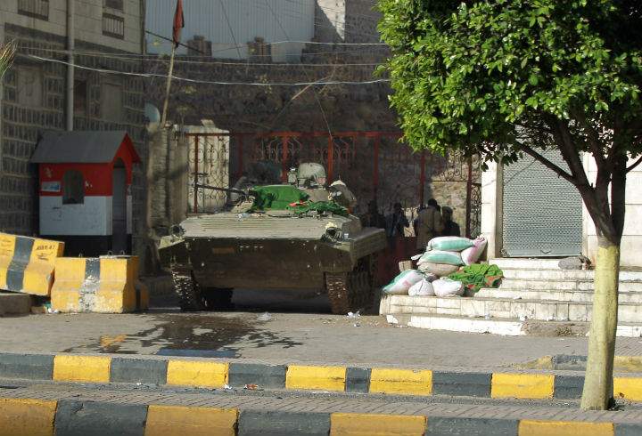 A tank is positioned next to home of Yemeni President Abed Rabbo Mansour Hadi in the capital, Sanaa, on Jan. 21.