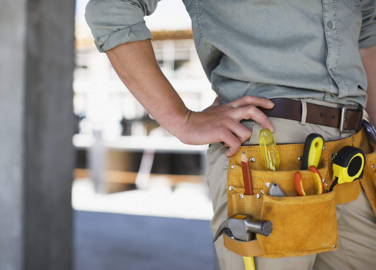 Close up of construction workers tool belt on construction site