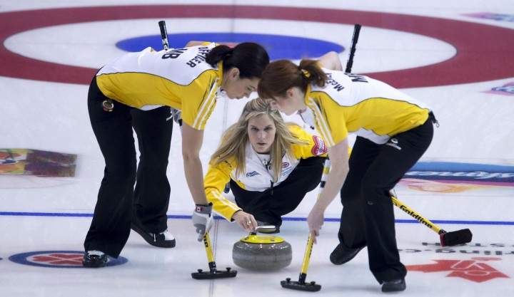 Jennifer Jones watches her shot as Jill Officer, left, and Dawn McEwen sweep at the Canadian women's curling championship last month. They begin world championship play this weekend.