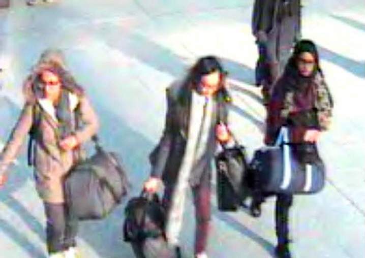 This is a still taken from CCTV issued by the Metropolitan Police in London on Monday Feb. 22, 2015, of 15-year-old Amira Abase, left, Kadiza Sultana,16, centre, and Shamima Begum,15 going through Gatwick airport, before they caught their flight to Turkey on Tuesday Feb 17, 2015. The three teenage girls left the country in a suspected bid to travel to Syria to join the Islamic State extremist group.