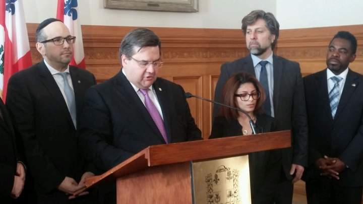 Montreal mayor Denis Coderre with Ensaf Haidar, Raif Badawi’s wife, who lives in Sherbrooke, Que. with the couple’s three children, on Monday, February 23, 2015.