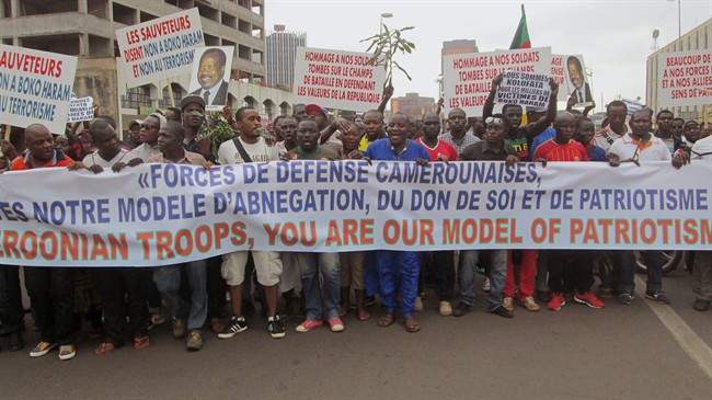 People take part in a march to show their support for the Cameroon army fighting against Boko Haram militants in the city of Yaounde, Cameroon, Saturday, Feb. 7, 2015.
