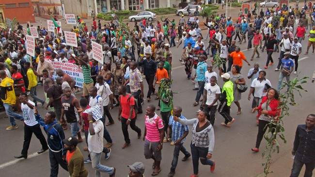 People take part in a march to show their support for the Cameroon army fighting against Boko Haram militants in the city of Yaounde, Cameroon, Saturday, Feb. 7, 2015. 
