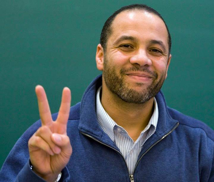 Adil Charkaoui flashes a victory sign at a news conference Wednesday, Oct. 14, 2009 in Montreal. A judge ruled against any apeals to the removal of the security certificate against him and removed all remaining bail conditions against Charkaoui who was suspected of being a terrorist.