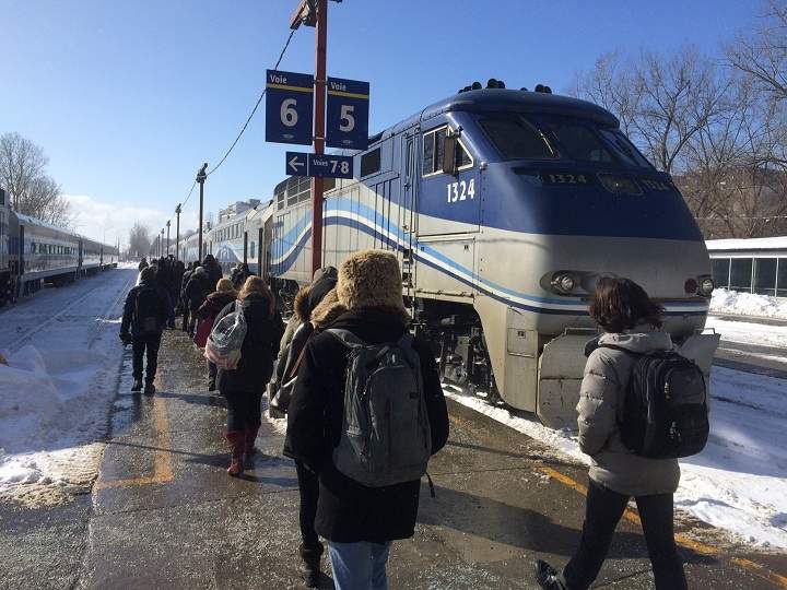 Commuters wait for an AMT train at the Lucien L'Allier Station in Montreal on February 13, 2015.