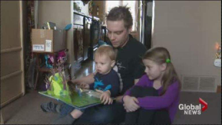 Adam Kingz, 29, pictured with his two children.
