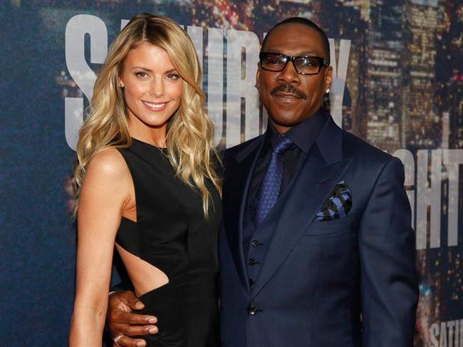 Paige Butcher, left, and Eddie Murphy attend the SNL 40th Anniversary Special at Rockefeller Plaza in New York on Feb. 15, 2015.