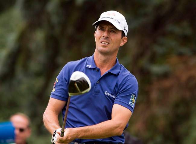 Mike Weir, from Bright's Grove, Ont., tees off during final round play at the Canadian Open golf championship Sunday, July 27, 2014 at Royal Montreal golf club in Montreal.
