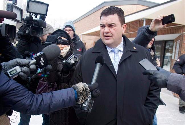 Former Conservative MP Dean Del Mastro talks to media as he leaves court for lunch break at a sentencing hearing in Peterborough Ont., Tuesday, January 27, 2015.