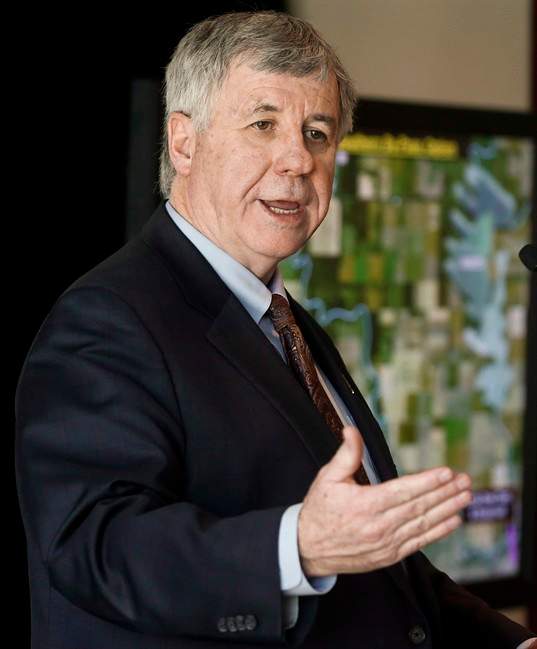 Alberta's finance minister Robin Campbell is expected to deliver more bad news when he presents an update on this year's budget. Campbell in shown in this Tuesday, April 29, 2014 file photo.