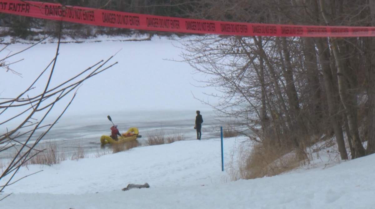 Adrian Antwright looks on as Edmonton Fire Rescue water rescue crew searches for his dog Clyde. Monday, February 23, 2015.